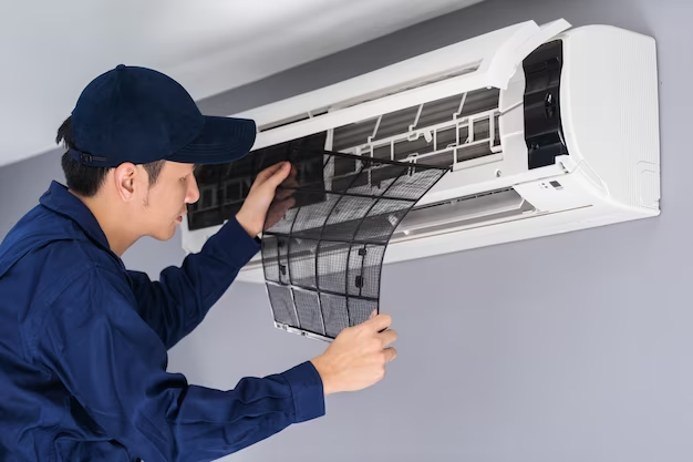 Technician repairing an air conditioner